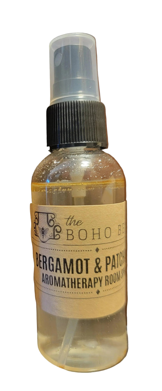 Bottle of Bergamot & Patchouli aromatherapy room spray on a wooden surface