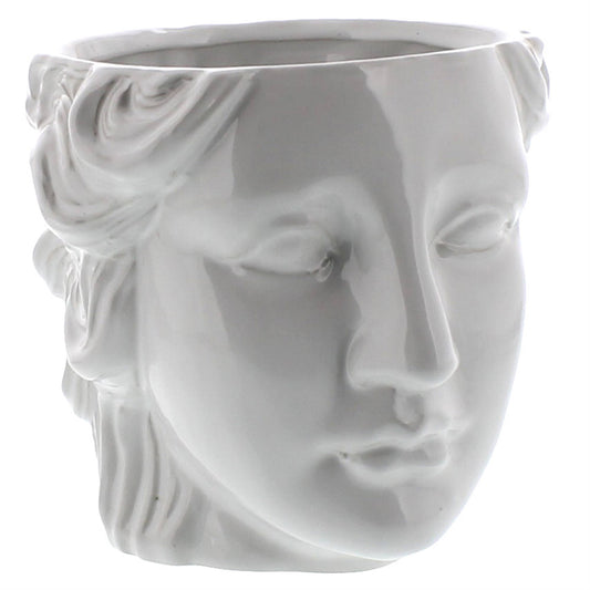 White ceramic vase shaped like a face with a floral design on a white background